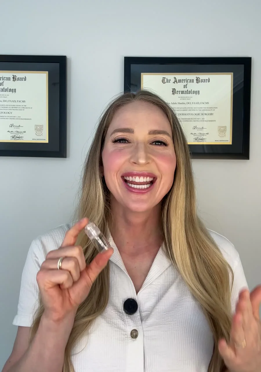 Dr. Carolyn Hardin holding a single-use Microfollic head and serum vial