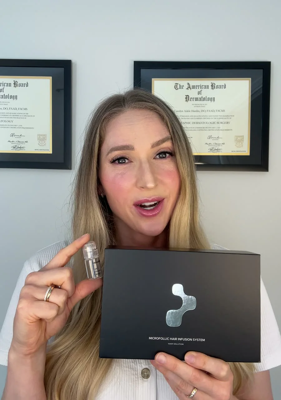 Dr. Carolyn Hardin holding the Microfollic Hair Infusion System